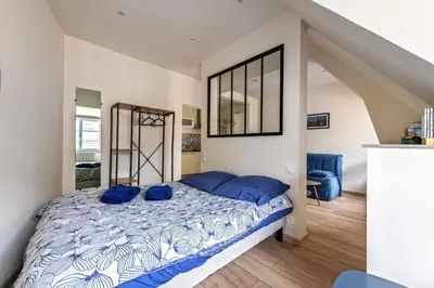 Un ou plusieurs lits dans un hébergement de l'établissement Studio Christiane - en plein coeur de Roscoff