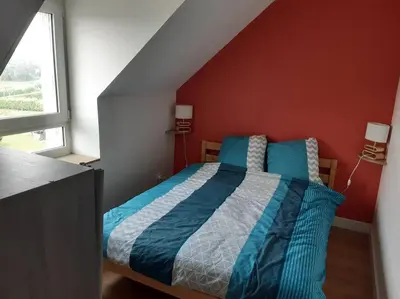 Un ou plusieurs lits dans un hébergement de l'établissement Agréable petit T3, à proximité de Quimper