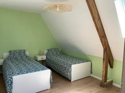 Un ou plusieurs lits dans un hébergement de l'établissement Gîte de Kermoal-Maison 2 chambres