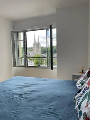 Un ou plusieurs lits dans un hébergement de l'établissement Le duplex Saint-Corentin - Hyper Centre - Parking Privé