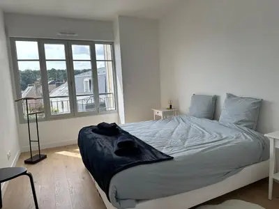 Un ou plusieurs lits dans un hébergement de l'établissement Le duplex Saint-Corentin - Hyper Centre - Parking Privé
