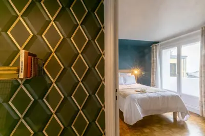 Un ou plusieurs lits dans un hébergement de l'établissement Mc Guigan's appart hôtel appartement