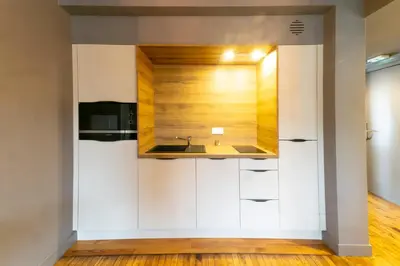Cuisine ou kitchenette dans l'établissement Mc Guigan's appart hôtel appartement