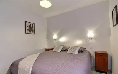 Un ou plusieurs lits dans un hébergement de l'établissement Appartement hyper centre avec garage privé