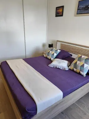Un ou plusieurs lits dans un hébergement de l'établissement Trébeurden appartement T 3 vue mer 3 ***