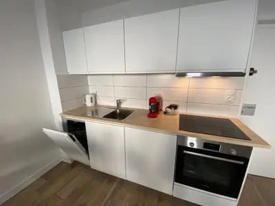 Cuisine ou kitchenette dans l'établissement COSY CONFORT LA PEROUSE 1A coeur de ville et plage