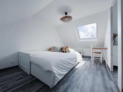 Un ou plusieurs lits dans un hébergement de l'établissement Gîte Familial 3 étoiles - Maison Kidour