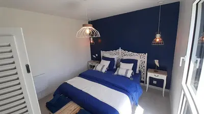 Un ou plusieurs lits dans un hébergement de l'établissement Maison neuve à deux pas de la superbe plage des Amiets