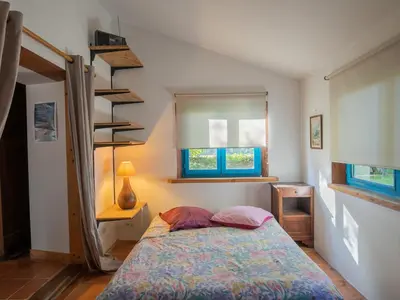 Un ou plusieurs lits dans un hébergement de l'établissement Holiday Home Le Petit Poirier by Interhome