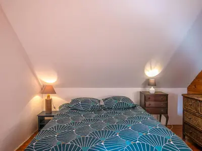 Un ou plusieurs lits dans un hébergement de l'établissement Holiday Home Le Petit Poirier by Interhome