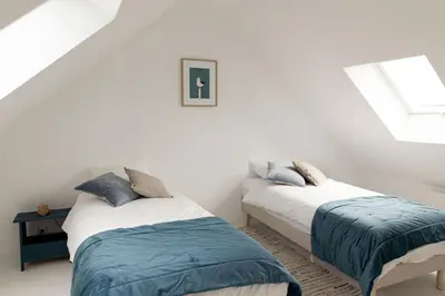 Un ou plusieurs lits dans un hébergement de l'établissement Men Louet E - Gîte de bord de mer