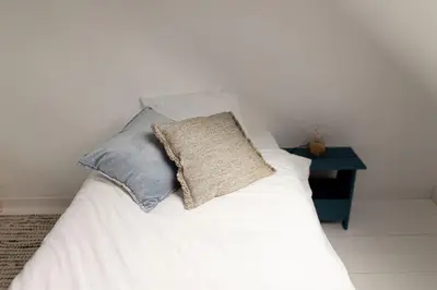 Un ou plusieurs lits dans un hébergement de l'établissement Men Louet E - Gîte de bord de mer