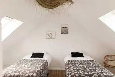 Un ou plusieurs lits dans un hébergement de l'établissement Men Louet O - Gîte de bord de mer