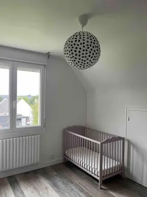 Un ou plusieurs lits dans un hébergement de l'établissement Maison au calme à Dirinon