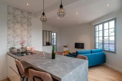 Télévision ou salle de divertissement dans l'établissement La Mouette - Appartement à 100m de la plage