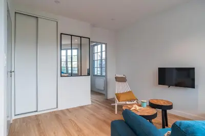 Télévision ou salle de divertissement dans l'établissement La Mouette - Appartement à 100m de la plage