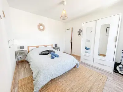 Un ou plusieurs lits dans un hébergement de l'établissement Superbe appartement T3 cosy de 60m2