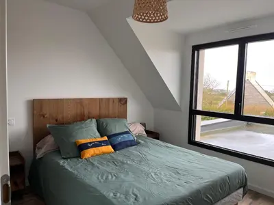 Un ou plusieurs lits dans un hébergement de l'établissement Maison de vacances à 200 m de l'Aber Benoît