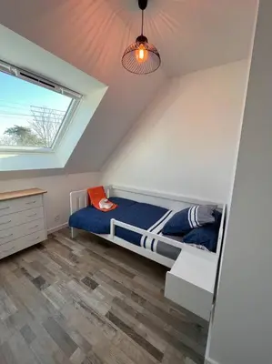 Un ou plusieurs lits dans un hébergement de l'établissement Maison de vacances à 200 m de l'Aber Benoît