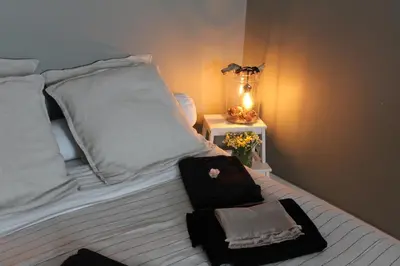 Un ou plusieurs lits dans un hébergement de l'établissement La Part des Anges 29 - Maison d'hôtes et Table épicurienne