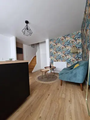 Coin salon dans l'établissement Le Cottage