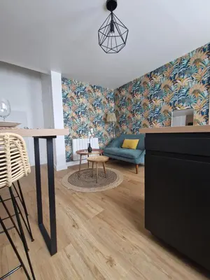 Coin salon dans l'établissement Le Cottage