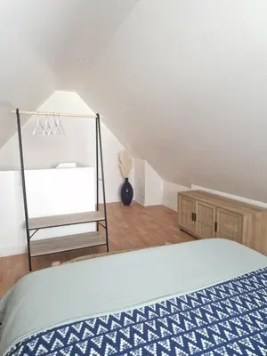 Un ou plusieurs lits dans un hébergement de l'établissement Le Cottage
