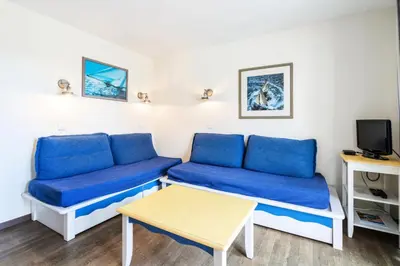 Télévision ou salle de divertissement dans l'établissement Résidence Cap Azur - maeva Home - Appartement 3 Pièces 6 Personnes - Confort MAE-1051
