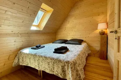 Un ou plusieurs lits dans un hébergement de l'établissement Ti Koad - La maison de bois