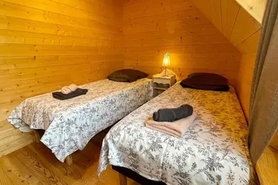 Un ou plusieurs lits dans un hébergement de l'établissement Ti Koad - La maison de bois
