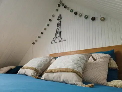 Un ou plusieurs lits dans un hébergement de l'établissement Ti vaen I Maison traditionnelle bretonne & Sauna
