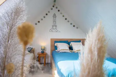 Un ou plusieurs lits dans un hébergement de l'établissement Ti vaen I Maison traditionnelle bretonne & Sauna
