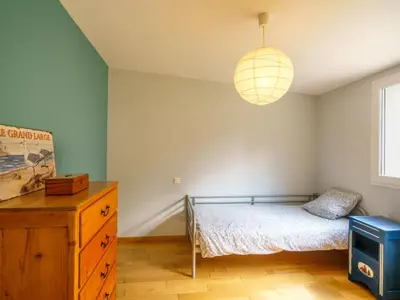 Un ou plusieurs lits dans un hébergement de l'établissement Holiday Home Maison du bois du Kador by Interhome