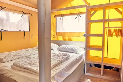 Un ou plusieurs lits dans un hébergement de l'établissement Glamping Bretagne