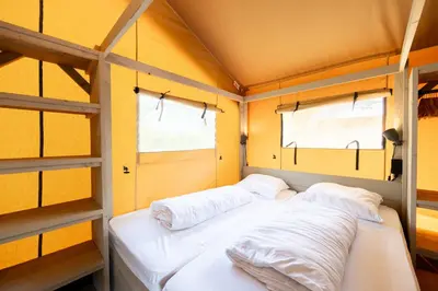 Un ou plusieurs lits dans un hébergement de l'établissement Glamping Bretagne