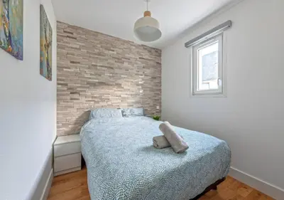 Un ou plusieurs lits dans un hébergement de l'établissement Charmant appartement vue mer - PLOUGONVELIN
