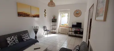 Coin salon dans l'établissement Maël-Carhaix location Maison 4 chambres