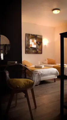 Un ou plusieurs lits dans un hébergement de l'établissement Hotel Le Derby