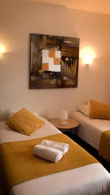 Un ou plusieurs lits dans un hébergement de l'établissement Hotel Le Derby