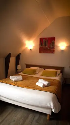 Un ou plusieurs lits dans un hébergement de l'établissement Hotel Le Derby