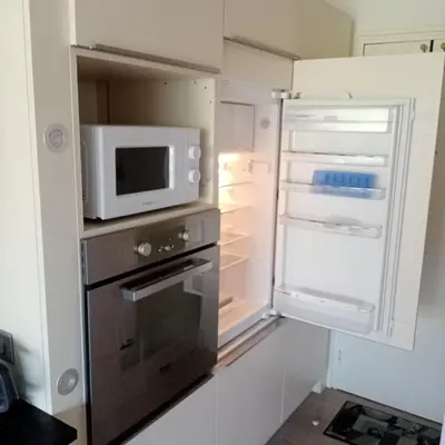 Cuisine ou kitchenette dans l'établissement Les Hortensias