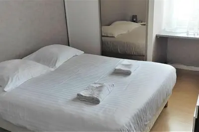 Un ou plusieurs lits dans un hébergement de l'établissement Jaurès-Pilier rouge/App spacieux/3 chambres/6 pers