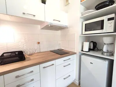Cuisine ou kitchenette dans l'établissement Appartement avec WIFI, terrasse, jardin à TREBEURDEN Réf - 678