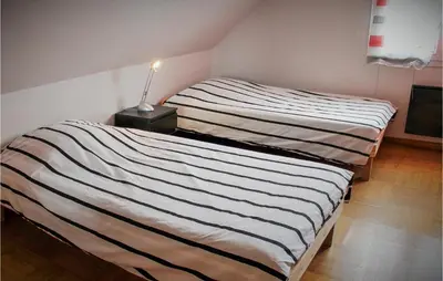 Un ou plusieurs lits dans un hébergement de l'établissement Beach Front Home In Plougonvelin