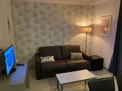 Coin salon dans l'établissement Chez Elisa - Dans Résidence 4 étoiles à Concarneau
