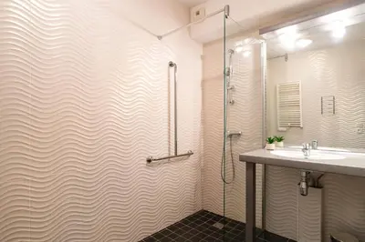 Salle de bains dans l'établissement Les Thermes 500 - Appt avec piscine partagée
