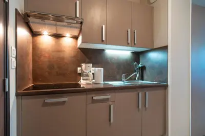 Cuisine ou kitchenette dans l'établissement Les Thermes 500 - Appt avec piscine partagée