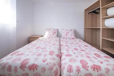 Un ou plusieurs lits dans un hébergement de l'établissement Villa Plain-Pied Vue Mer