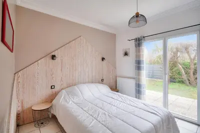 Un ou plusieurs lits dans un hébergement de l'établissement Maison 5 chambres avec accès direct à la plage