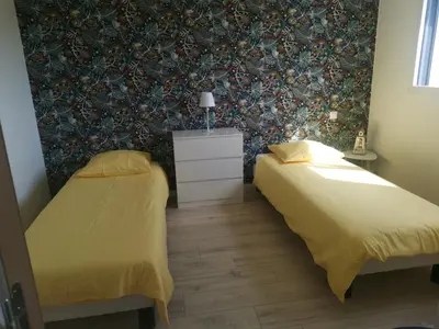 Un ou plusieurs lits dans un hébergement de l'établissement Célest' Inn
